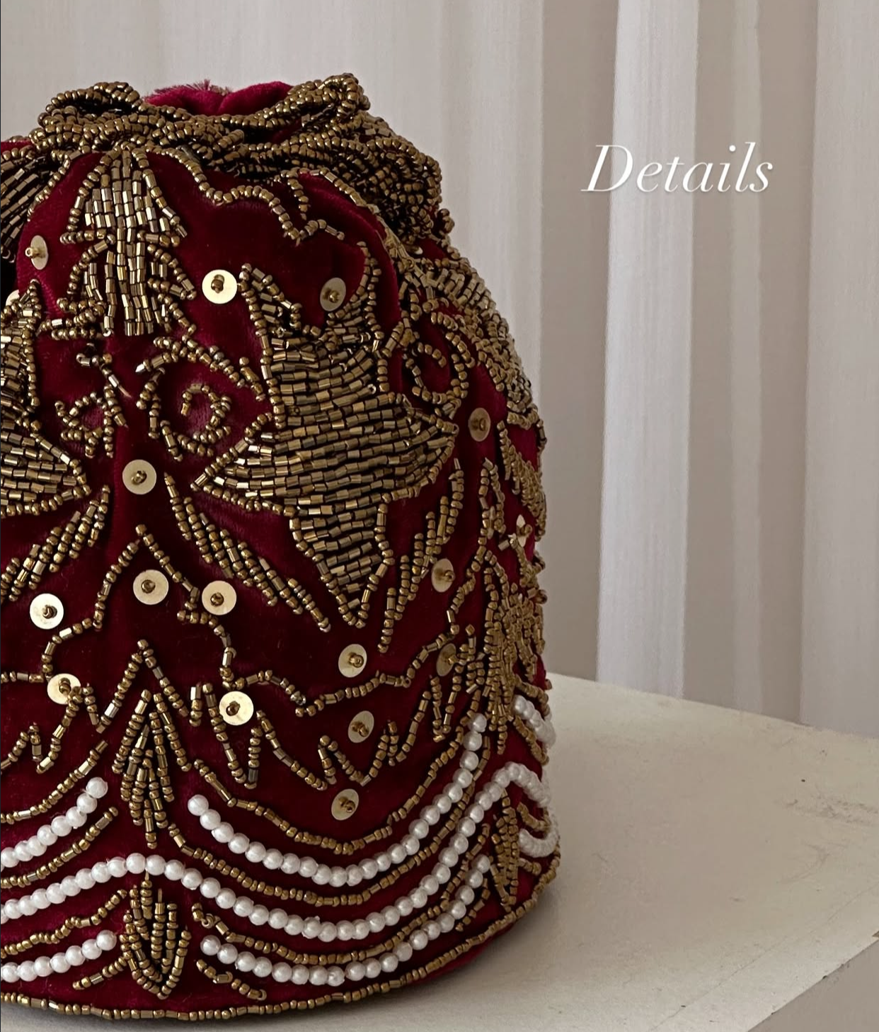 Red embellished potli wedding