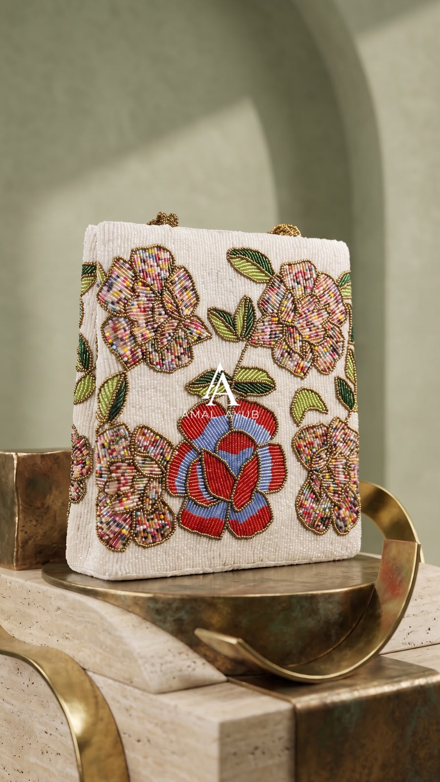 Amal Ayub white embellished handbag featuring handcrafted red, blue, and pastel floral beadwork with braided gold handles