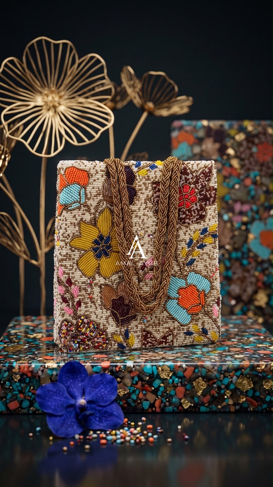 Amal Ayub cream embellished handbag with handcrafted yellow, turquoise, and coral floral beadwork and braided gold handles