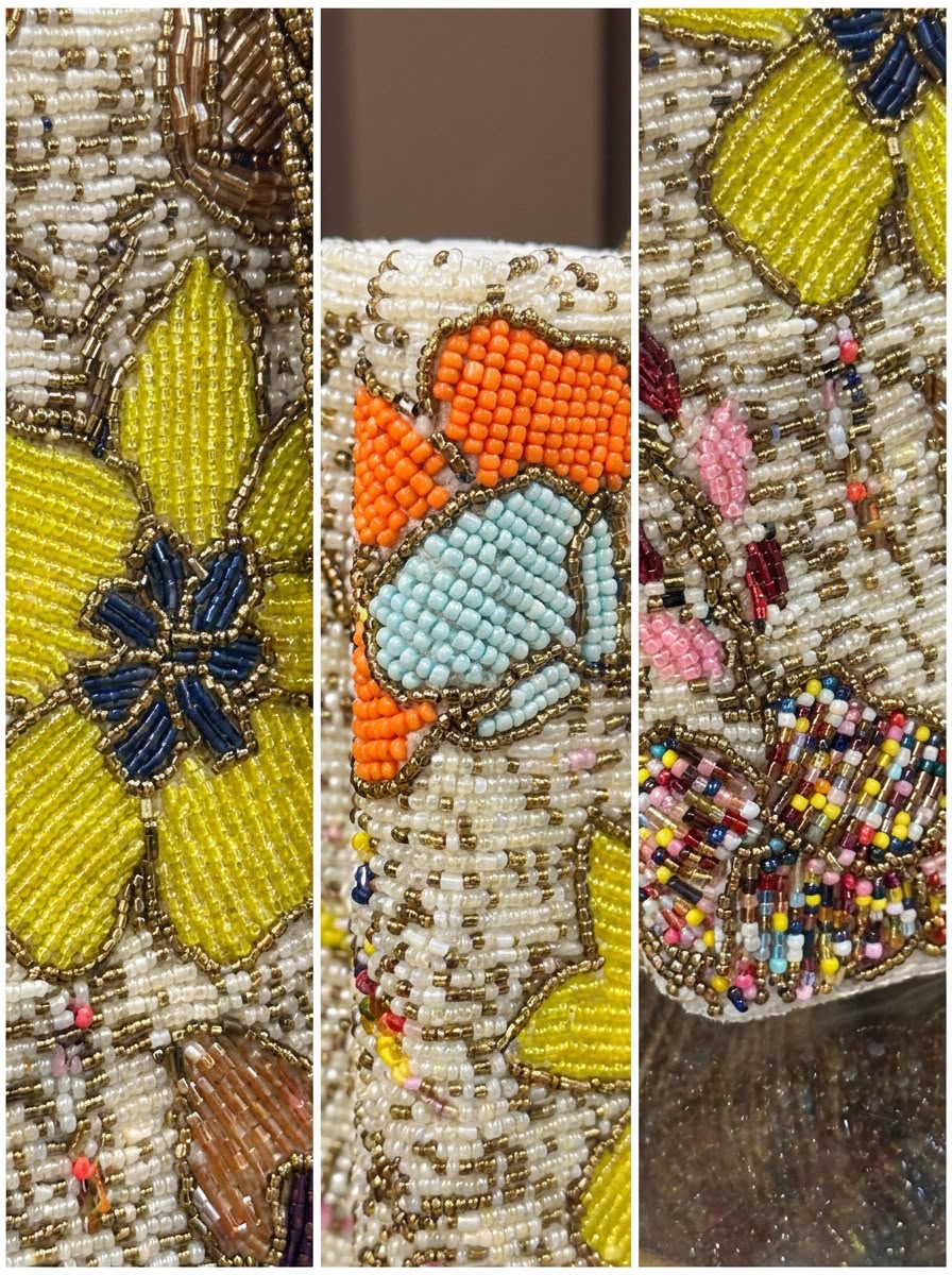 Close-up of Amal Ayub hand-embroidered glass seed bead flowers, gold thread outlines, and edge border detailing