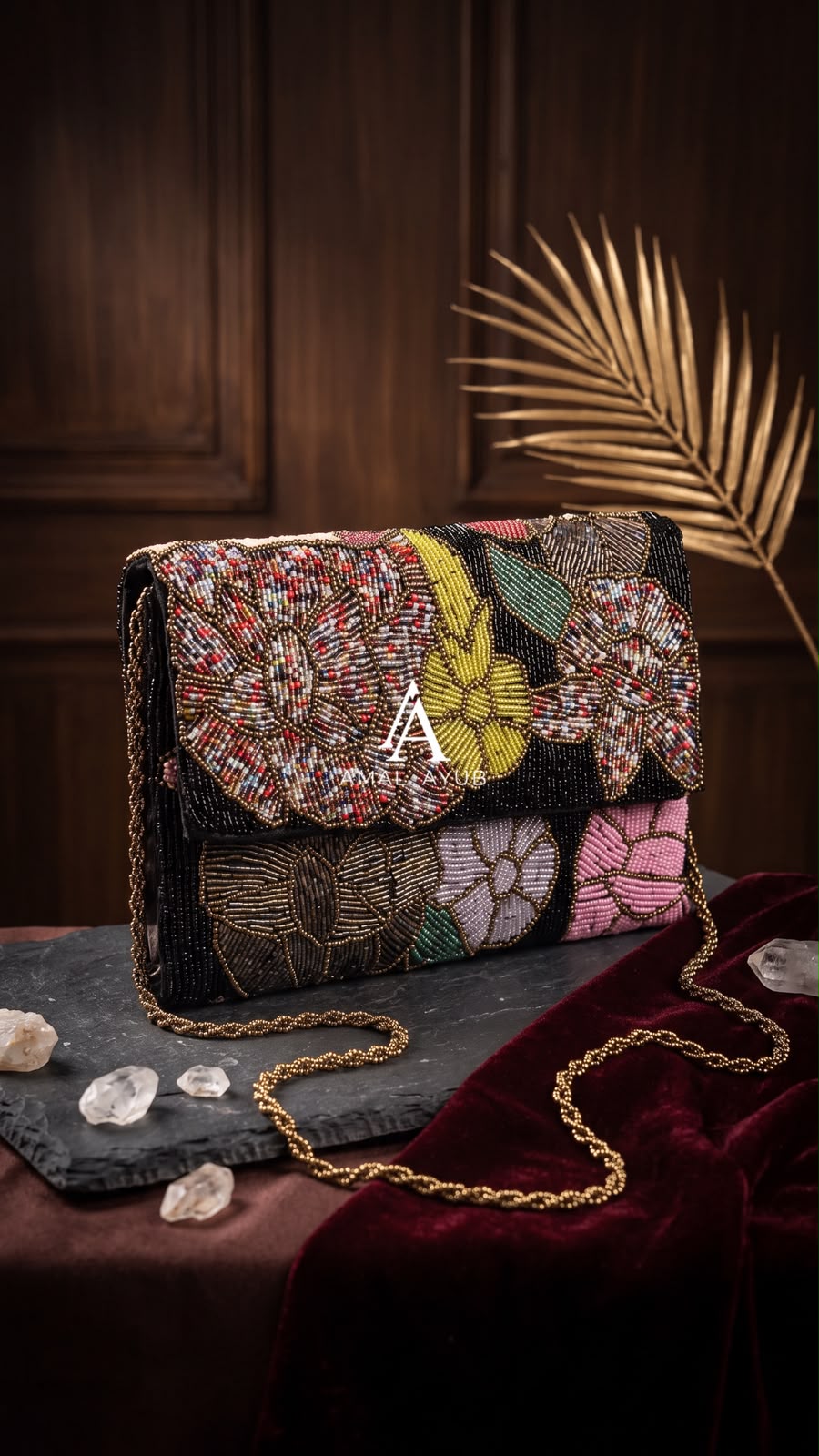 Amal Ayub black hand-embellished flap handbag with confetti, mustard, and pink floral beadwork and gold chain strap