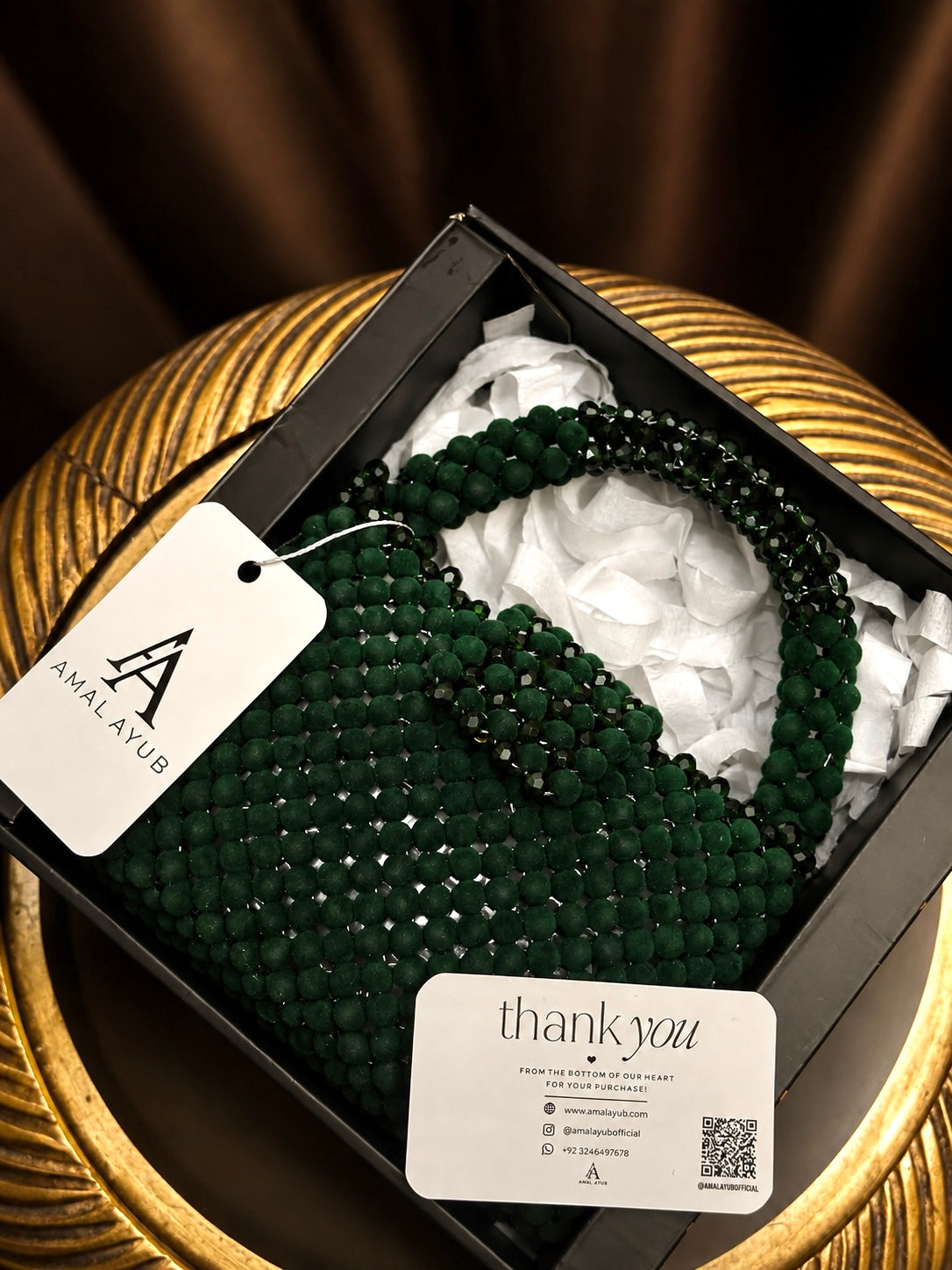 Handcrafted emerald green crystal beaded handbag with top handle by Amal Ayub