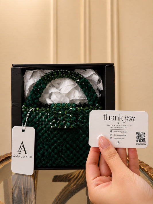 Handcrafted emerald green crystal beaded handbag with top handle by Amal Ayub