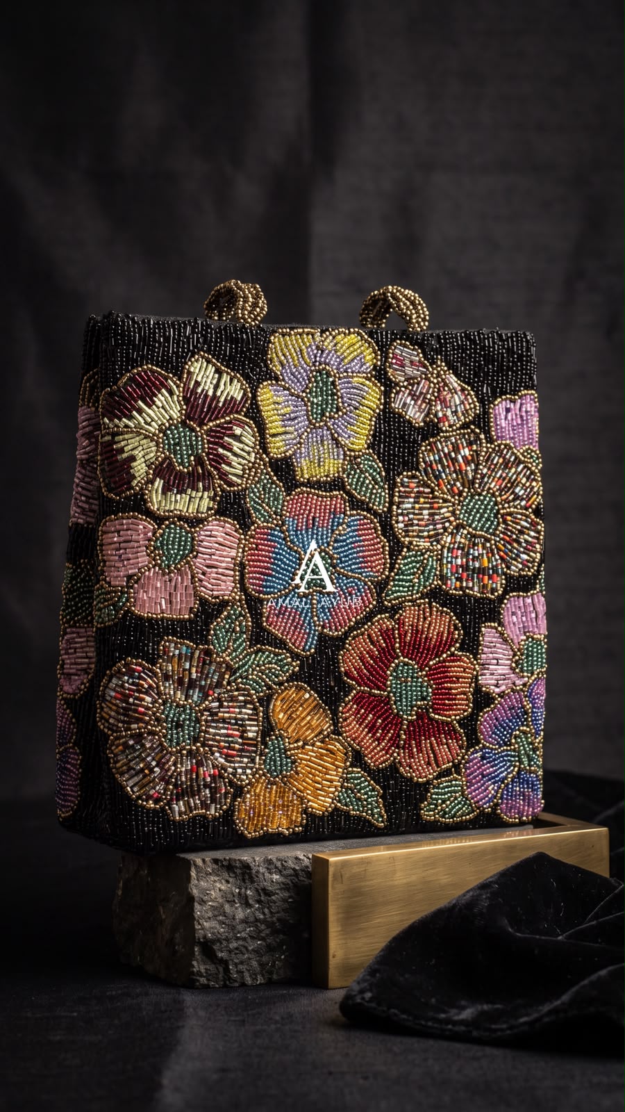 Amal Ayub black hand-embellished box handbag with multicolor jewel-toned floral beadwork and gold knot handle