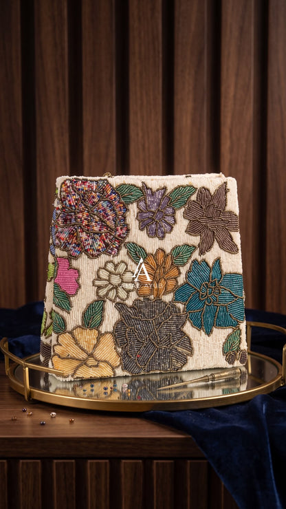 Amal Ayub cream hand-embellished box handbag with multicolor floral beadwork and gold clasp