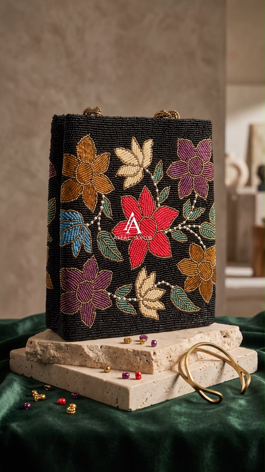  Amal Ayub black hand-embellished box handbag with red, mustard, and purple floral beadwork and gold knot handle