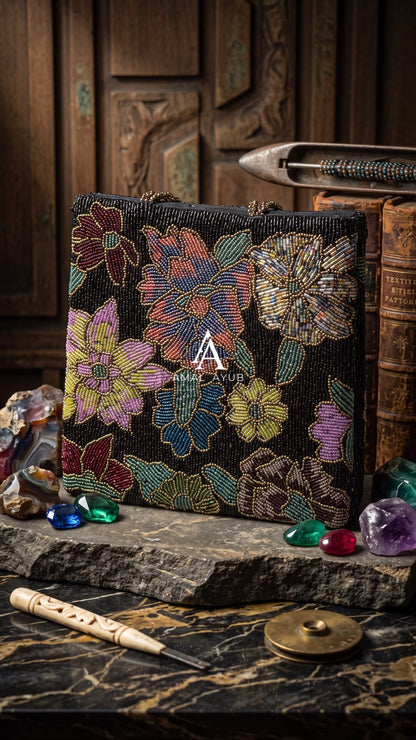 Amal Ayub structured black embellished handbag featuring handcrafted jewel-toned mosaic floral beadwork and braided gold handles