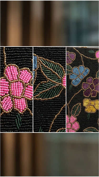 Close-up details of Amal Ayub hand-embroidered glass seed bead pink flowers, green leaves, and gold thread vine outlines